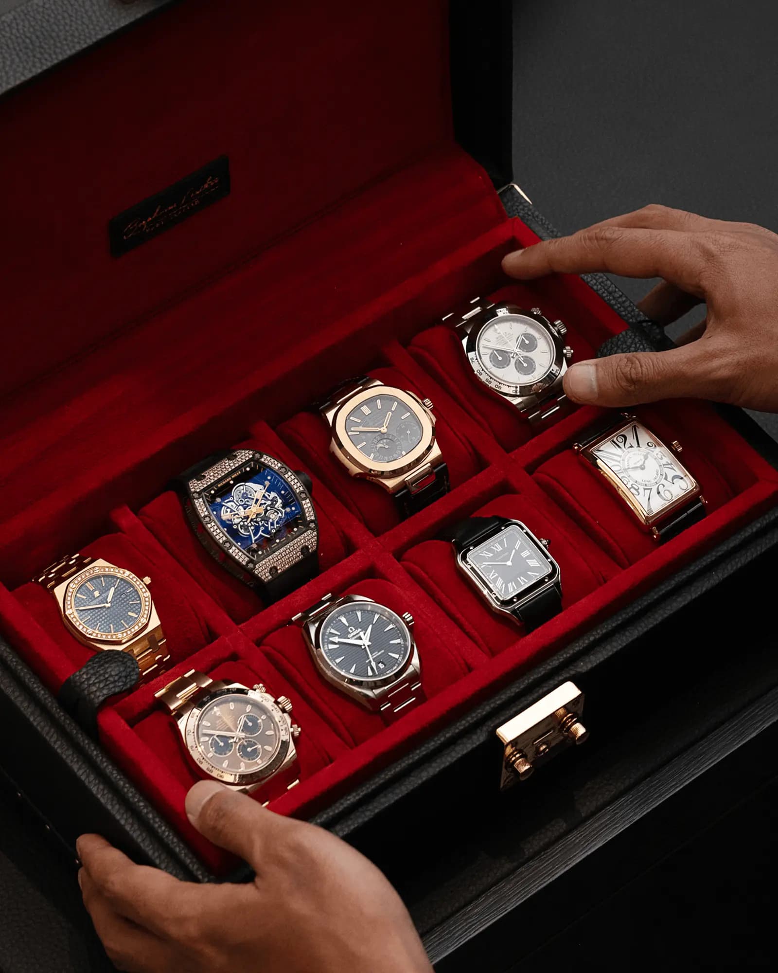 Luxury watches in a red-lined presentation case